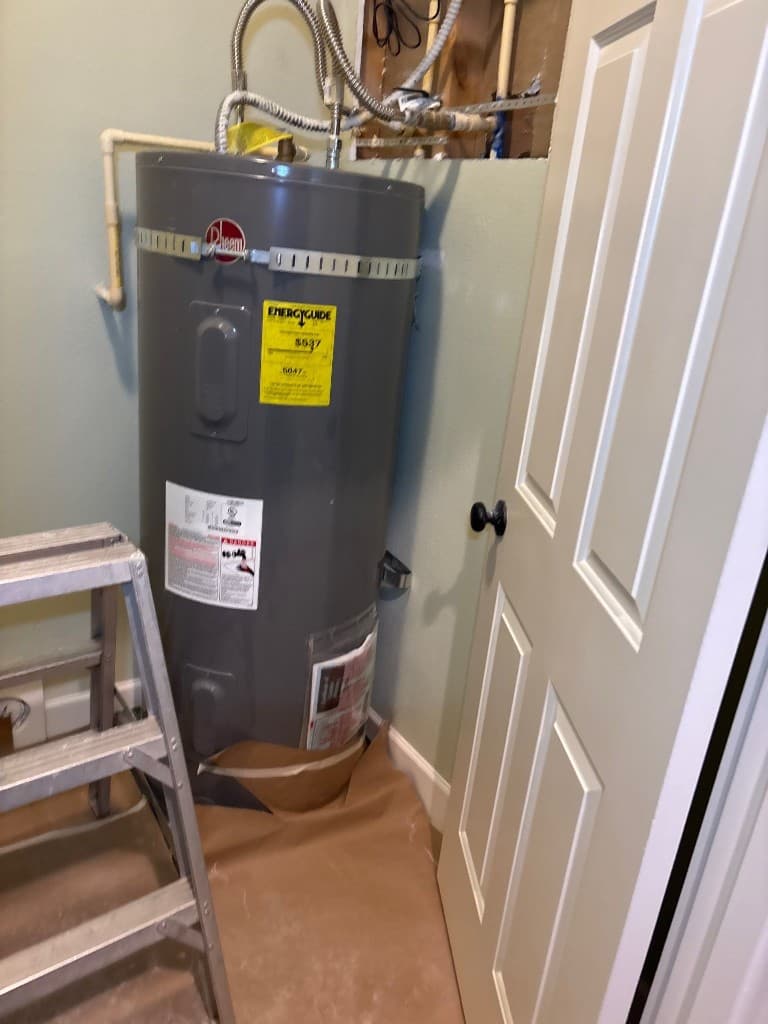 Water heater area after repipe with updated lines and connections