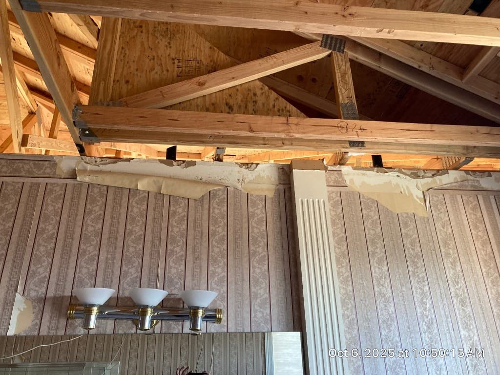 Top-wall access opened for roof vent corrections after fire-related structural repair