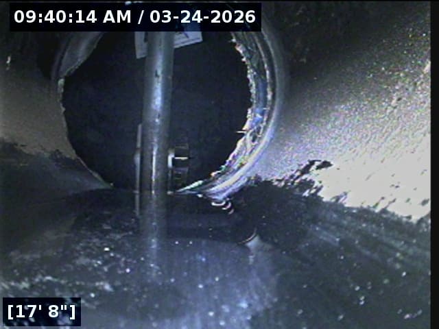 Plumber looking at camera inspection screen
